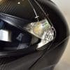 AGV Sportmodular Carbon Gloss helmet visor pivot point and quick release system.