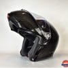 AGV Sportmodular Carbon Gloss helmet chinbar raised, sun lens lowered from the left side.