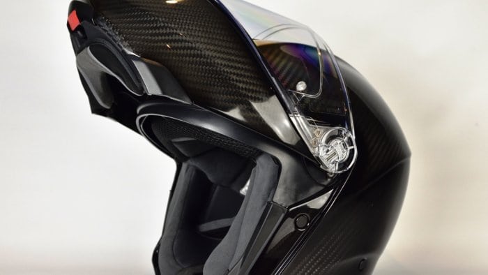 AGV Sportmodular Carbon Gloss helmet chinbar raised, sun lens lowered from the left side.