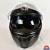 AGV Sportmodular Carbon Gloss helmet with chinbar lowered and sun lens lowered.
