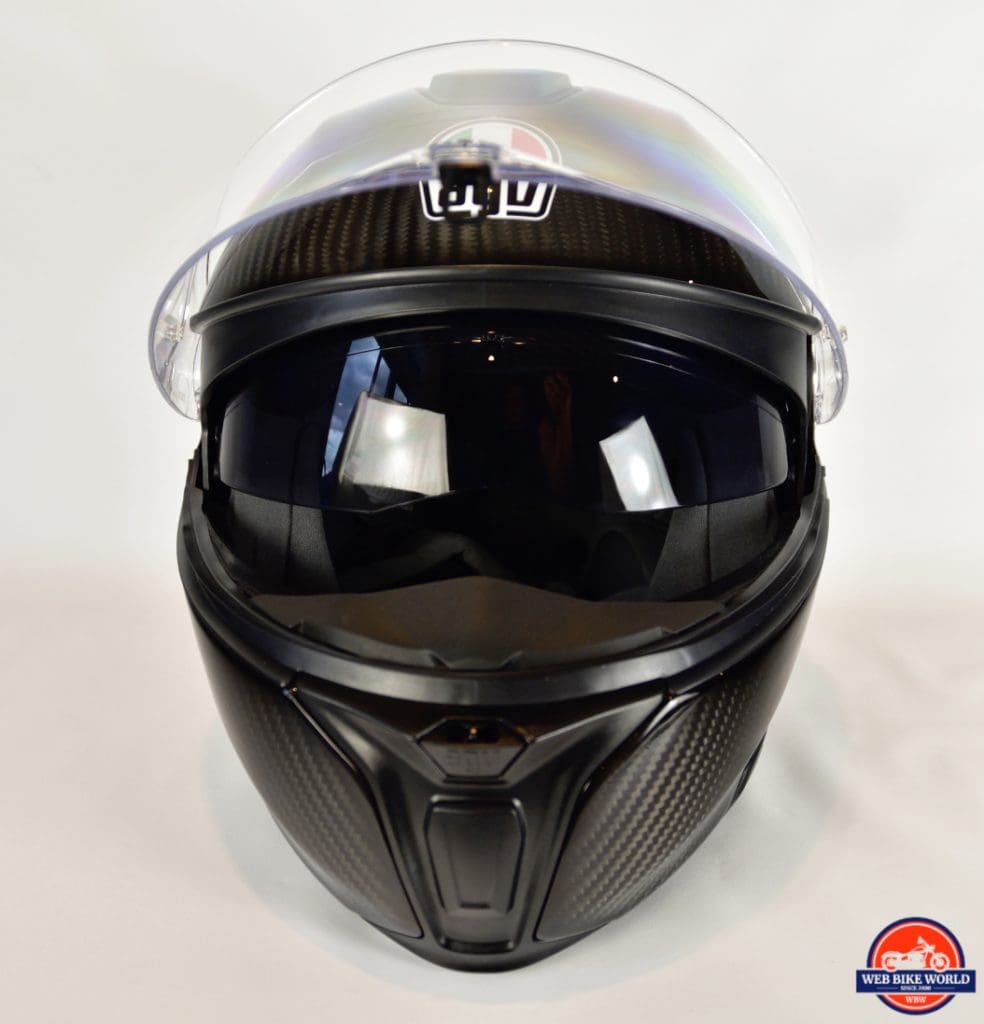 AGV Sportmodular Carbon Gloss helmet with chinbar lowered and sun lens lowered.