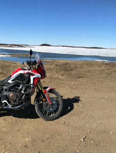 My 2017 Honda Africa Twin Next to the Tuktoyaktuk Entrance Sign