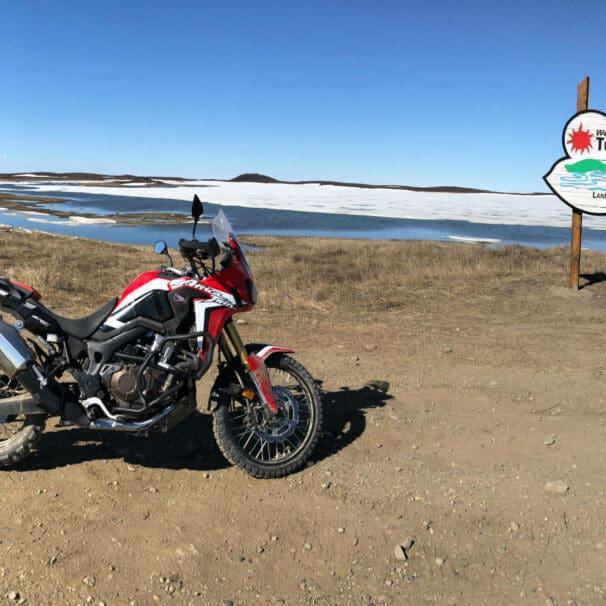 My 2017 Honda Africa Twin Next to the Tuktoyaktuk Entrance Sign