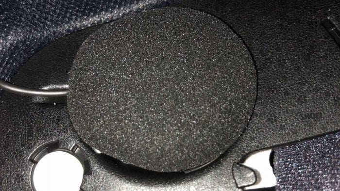 Speaker attached to velcro tab in helmet