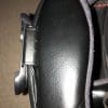 Metal bracket mounted to side of helmet- wires fit neatly under the helmet pads