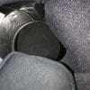 Helmet pads reinserted over wires with speaker exposed