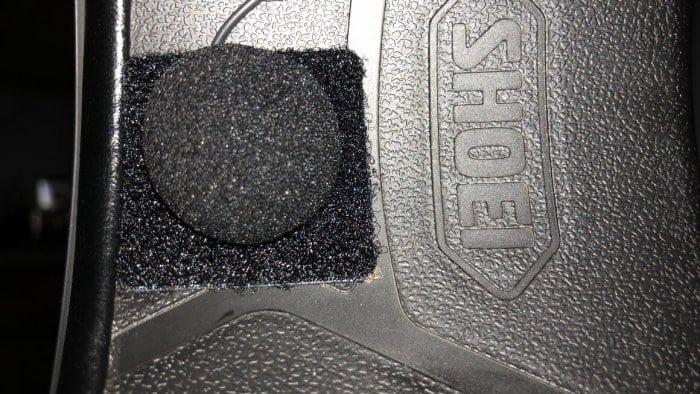 Microphone attached to velcro tab at front of helmet