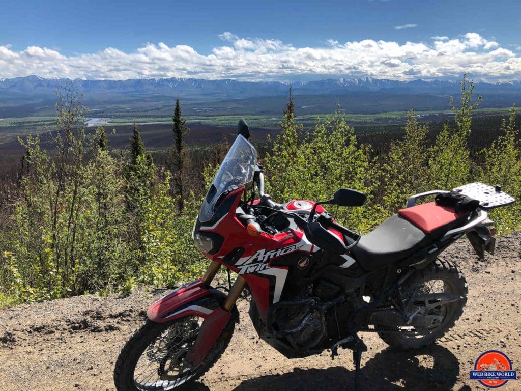 An Africa Twin overlooking the Ogilvie Ridge on the Dempster Highway.