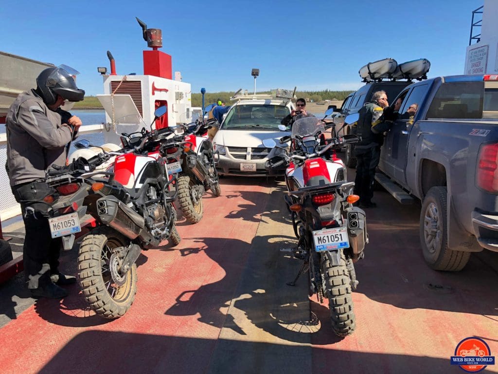 The Peel River ferry loaded with Africa Twins on the Dempster Highway.