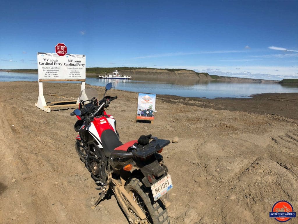 The MacKenzie River ferry packed with vehcles on the Dempster Highway.