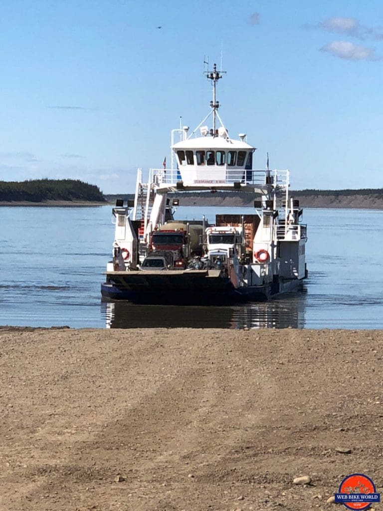 The MacKenzie River ferry packed with vehcles on the Dempster Highway.