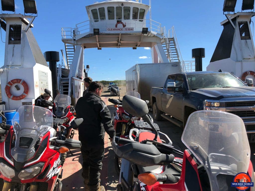 The MacKenzie River ferry packed with vehcles on the Dempster Highway.