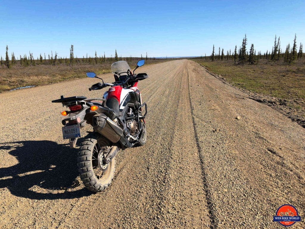 The gravel covered Dempster Highway and my 2017 Honda Africa Twin.