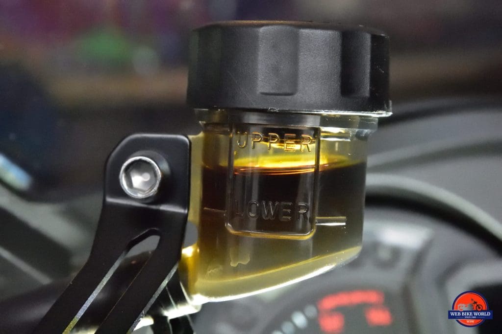 2018 Kawasaki Ninja H2SXSE clutch fluid reservoir with dark fluid in it.