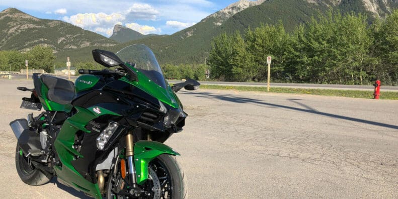 2018 Kawasaki Ninja H2SXSE with mountains in the background.