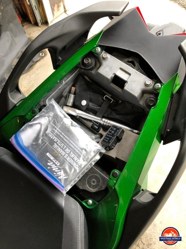 2018 Kawasaki Ninja H2SXSE tool storage compartment.