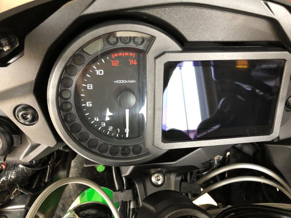 Scratched tachometer cover on a 2018 Kawasaki Ninja H2SXSE.