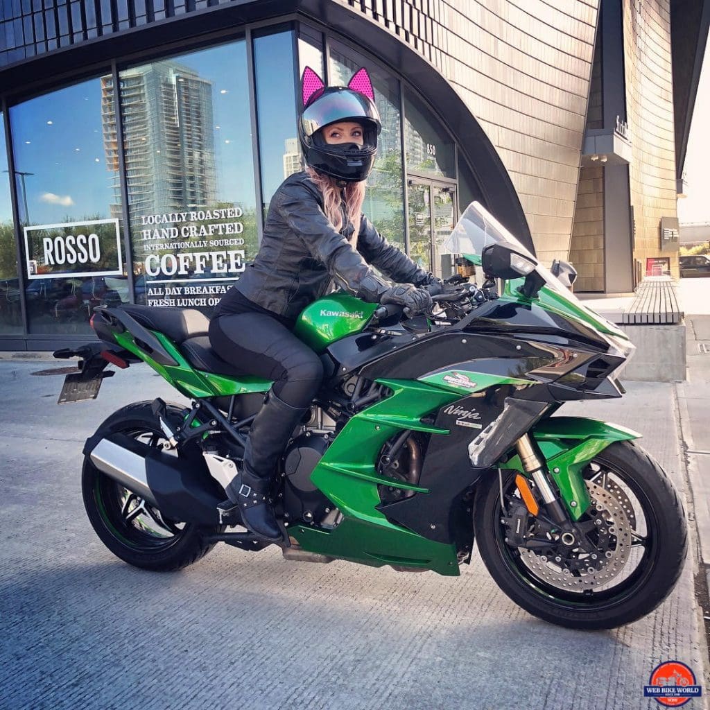 Catwoman riding a 2018 Kawasaki Ninja H2SXSE.