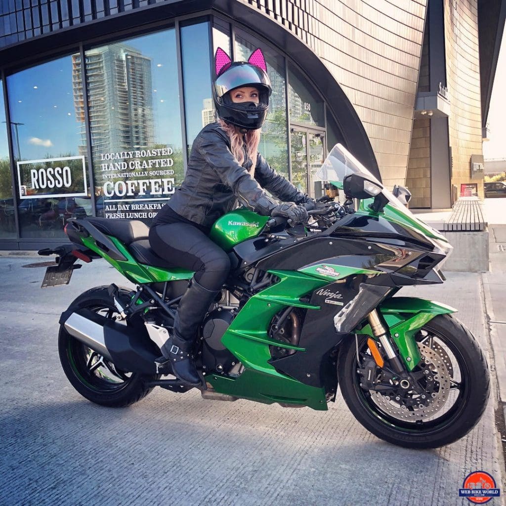 Catwoman riding a 2018 Kawasaki Ninja H2SXSE.