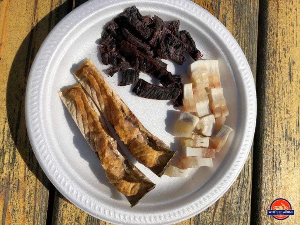 A plate of muktuk or beluga meat and dried fish in Tuktoyaktuk.