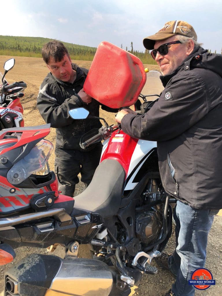 Wade and Matt fueling up the Honda Africa Twins on the Dempster Highway.