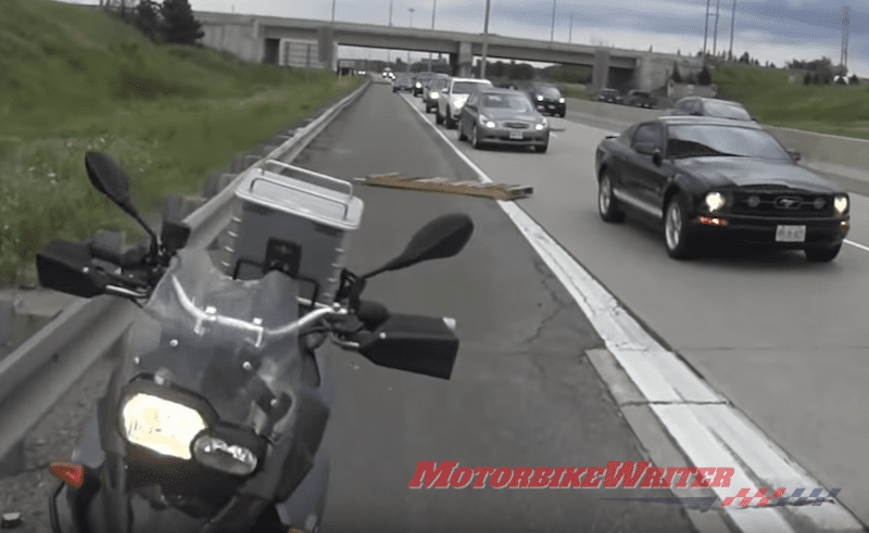Video: Rider avoids debris from truck