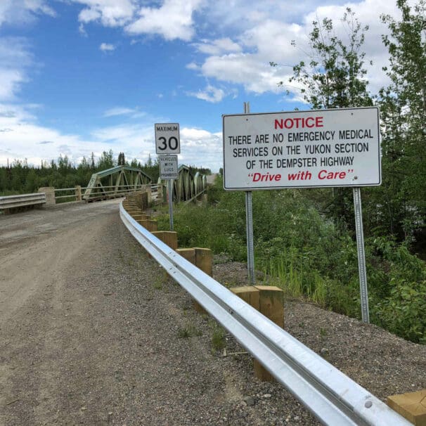 Warning sign at the beginning of the Dempster Highway, Yukon. No emergency services.