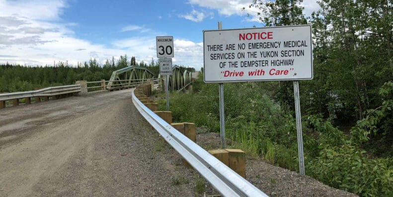 Warning sign at the beginning of the Dempster Highway, Yukon. No emergency services.