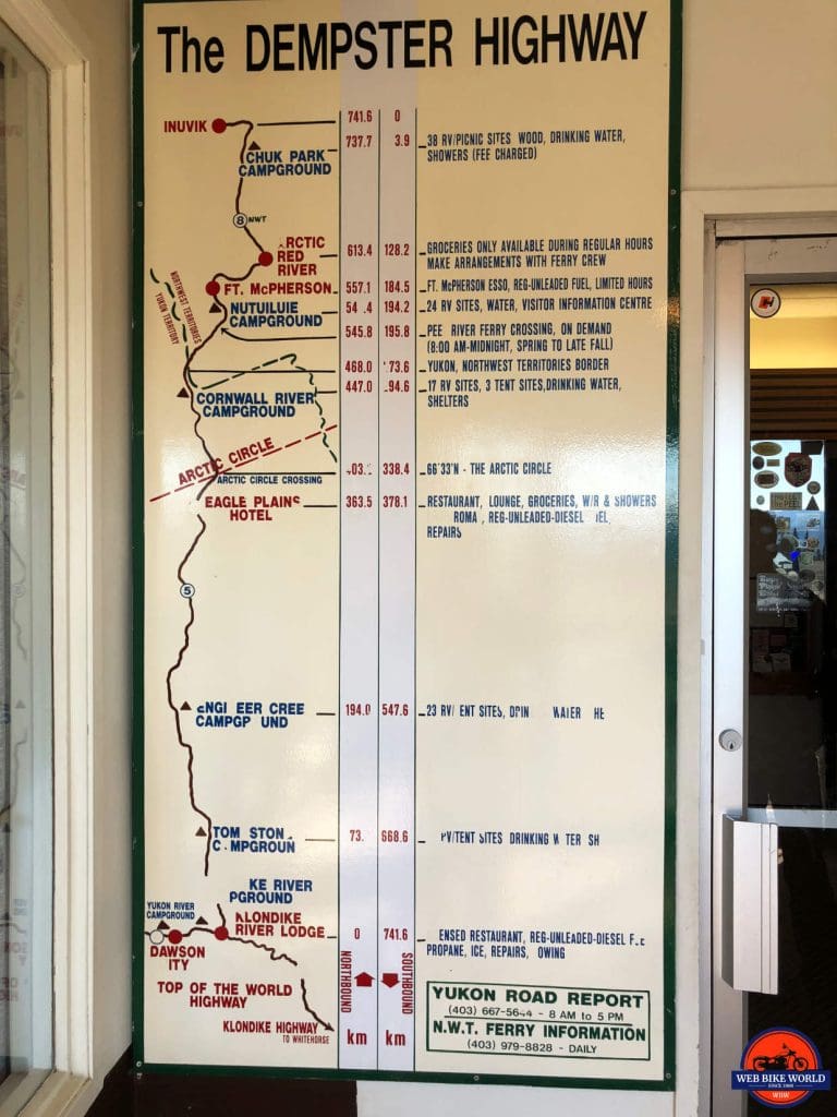 Sign showing the Dempster highway from Dawson City to Inuvik.