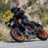 A KTM duke leans into a right turn.