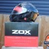 ZOX Brigade SVS Solid Helmet on top of Zox box