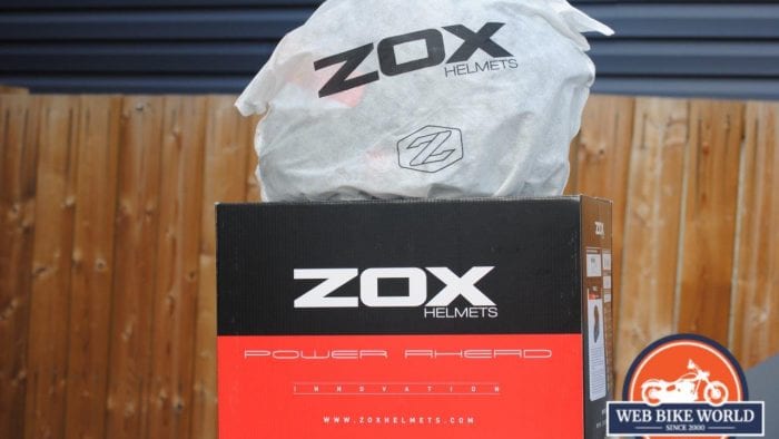 ZOX Primo C Track Helmet in protective fleece helmet bag on top of ZOX Box