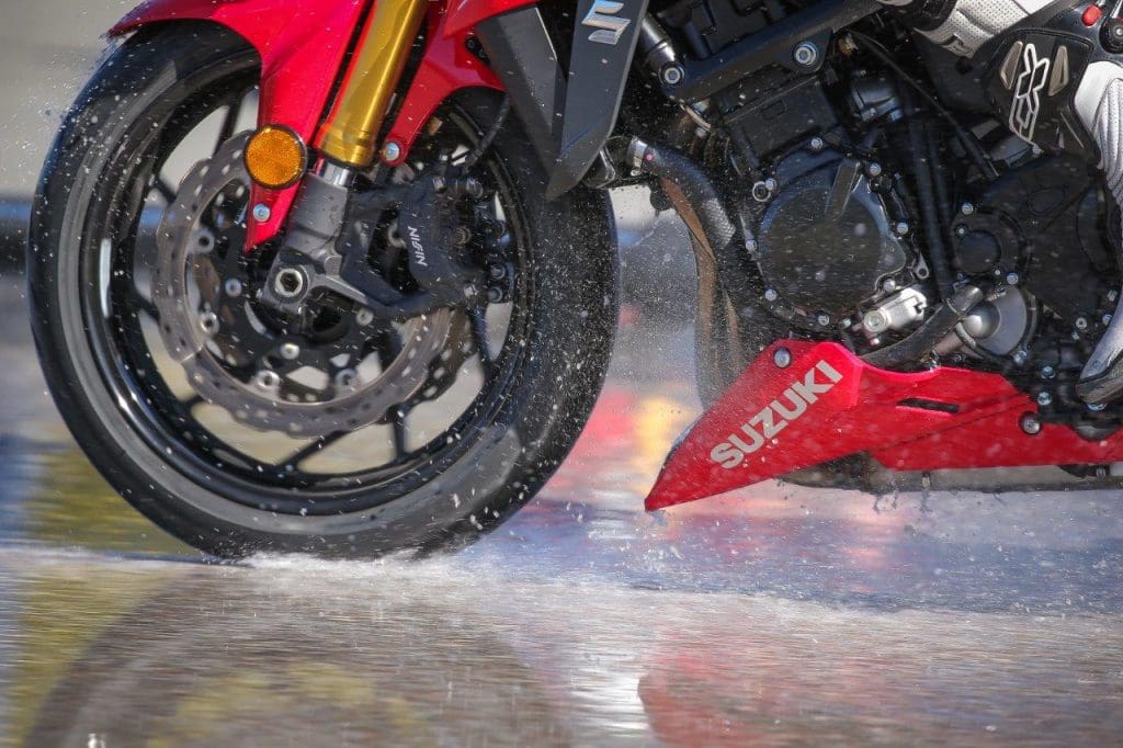 Michelin Road 5 tires being tested on a very wet road.