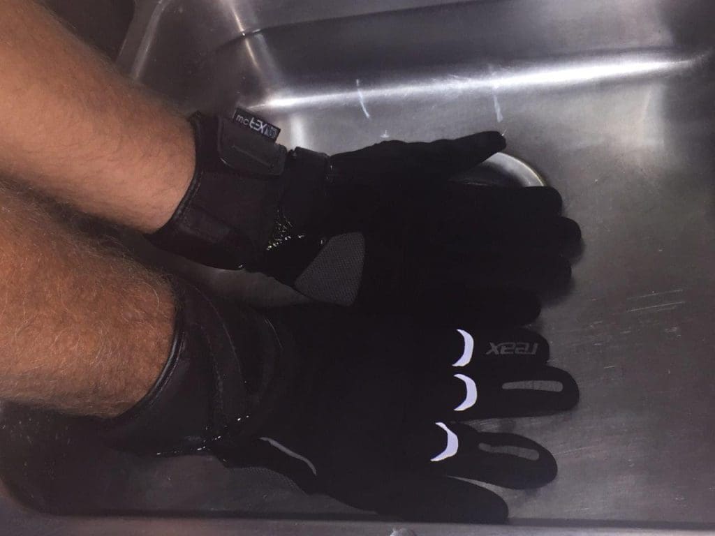 REAX Ridge Waterproof Gloves undergoing a waterproof test in sink