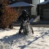 Me riding through the snow while wearing the Velomacchi 40L Speedway Backpack.