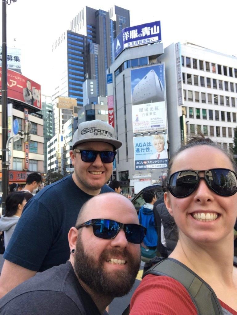 Brett (bottom), Jordan (right) and their friend Jeff (left) enjoying Japan after the competition