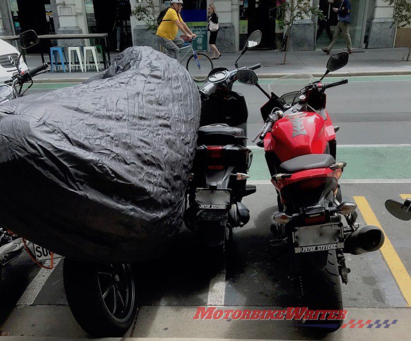 Rude riders squeezing between parked motorbikes - webBikeWorld