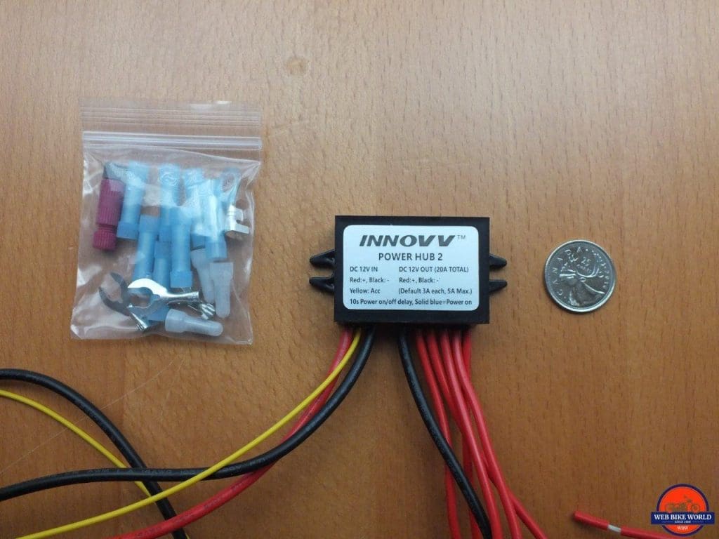 INNOVV Power Hub 2 with coin for scale