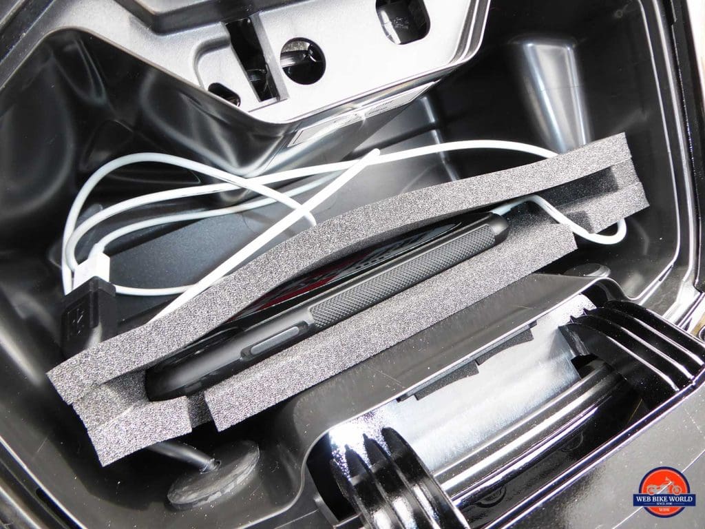 Honda Gold Wing DCT cell phone compartment with iPhone X in it.