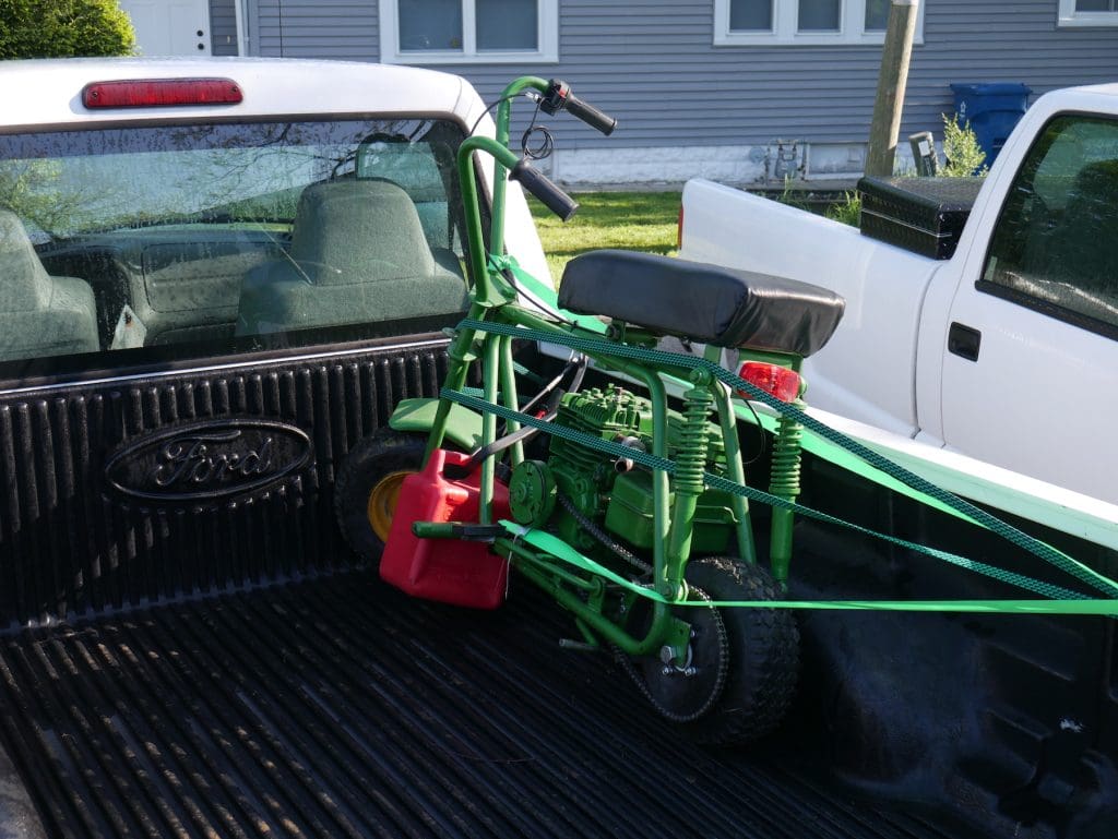 green minibike in a truck bed for Pullstart racing league