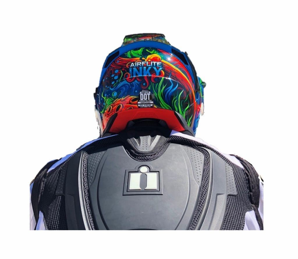 Icon Airflite Inky helmet rear view of helmet meeting jacket back protector