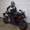 ICON Women’s Automag 2 Jacket worn by Brittany, next to her motorcycle