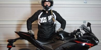 ICON Women’s Automag 2 Jacket worn by Brittany next to her motorcycle