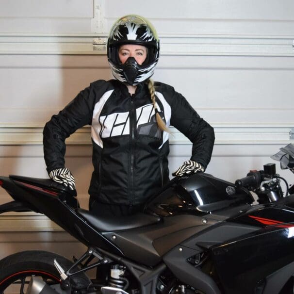 ICON Women’s Automag 2 Jacket worn by Brittany next to her motorcycle