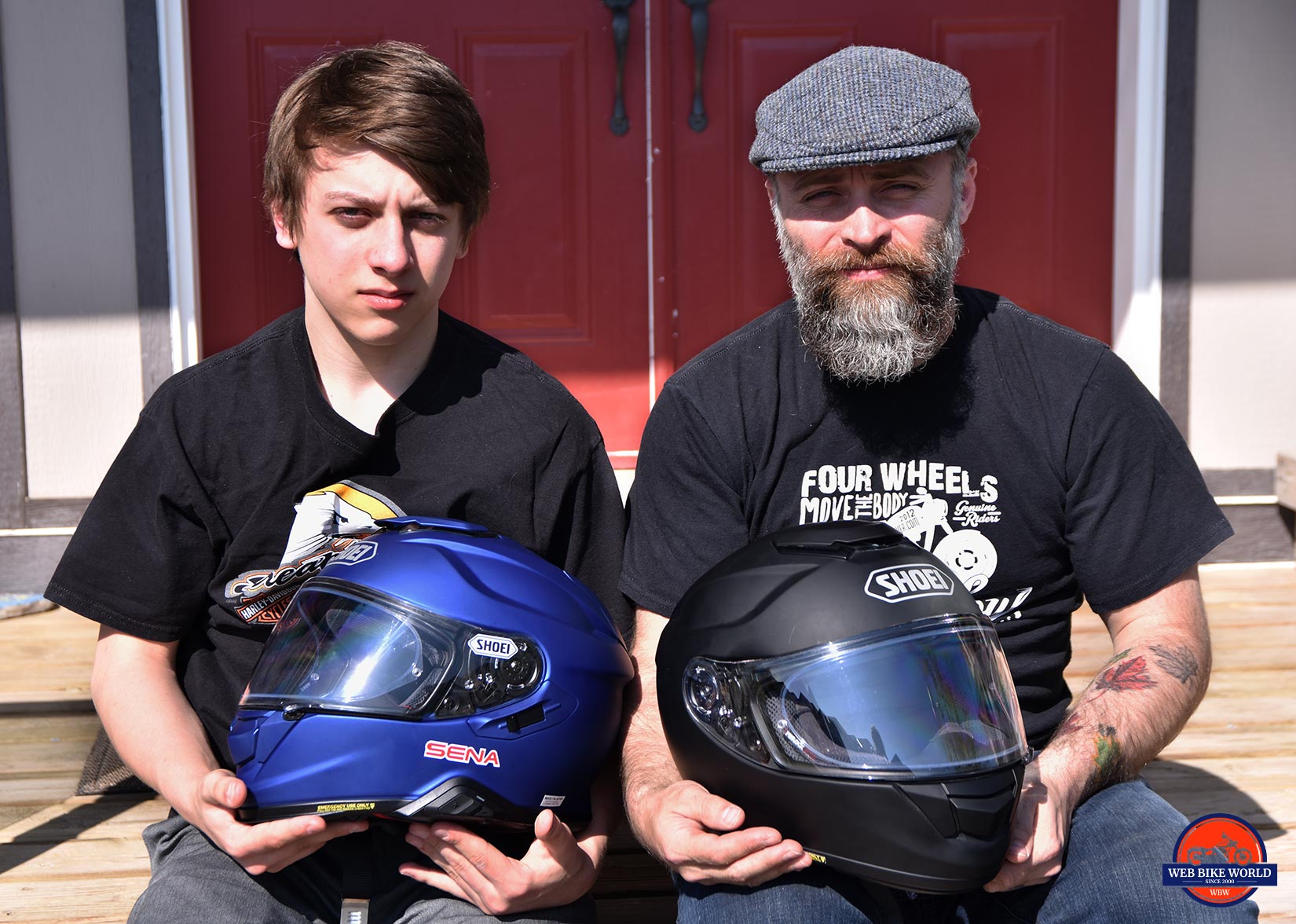 Father and son holding the Shoei GT Air and GT Air II helmets.