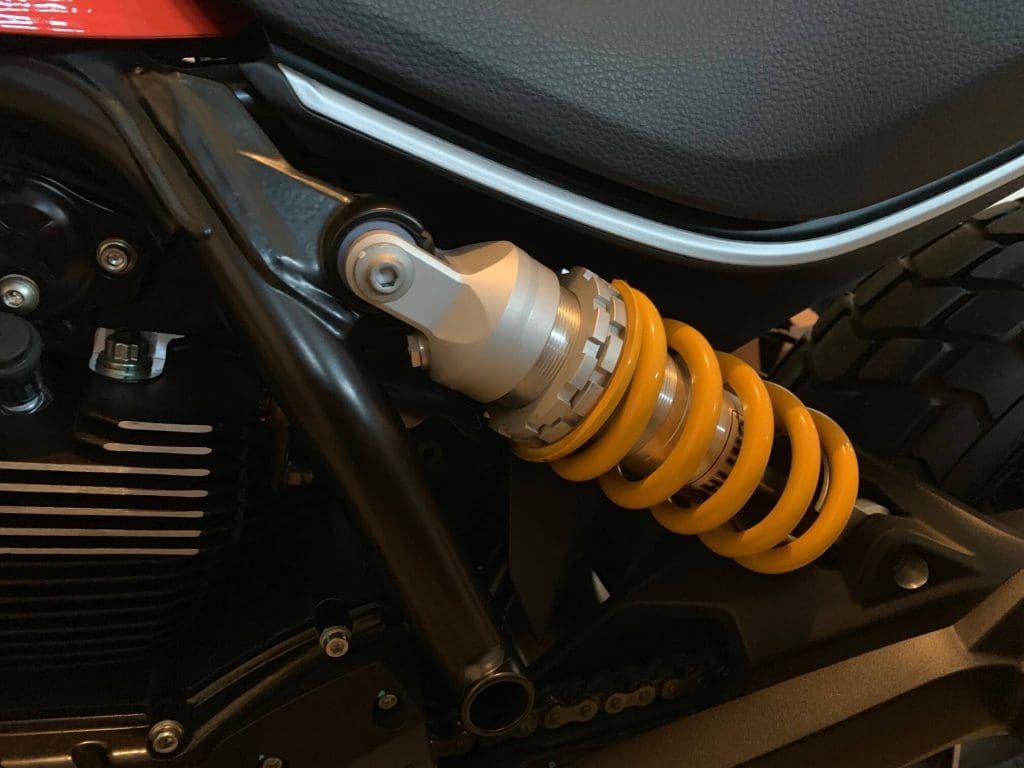 Lowering a Ducati Scrambler, closeup of the Öhlins shock installation