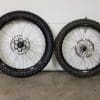 Custom moto 21" wheel on the left - OEM 19" on the right