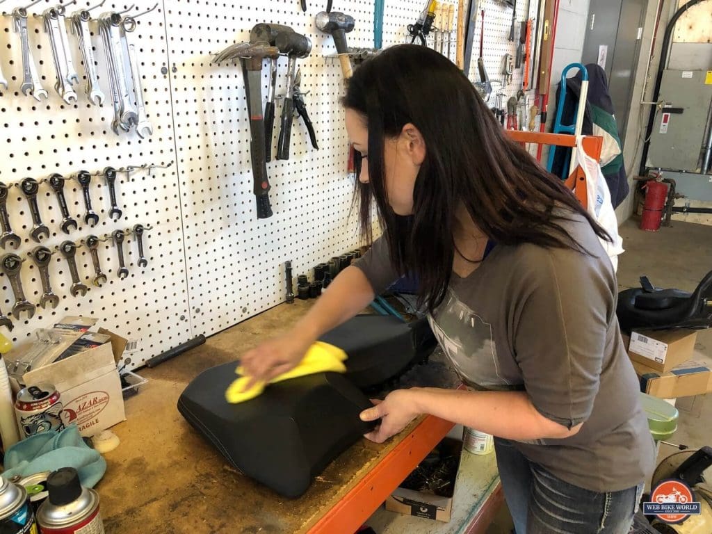 Kate coating my leather seat with Feynlab protection.