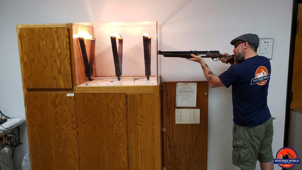 Me shooting a pellet at a helmet visor in the Snell laboratory.