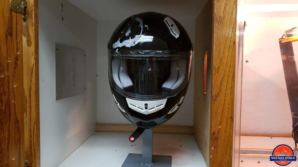 A helmet visor marked for impact testing at the Snell Laboratory.